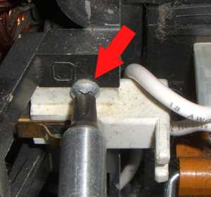 Remove Kirby motor brush screw